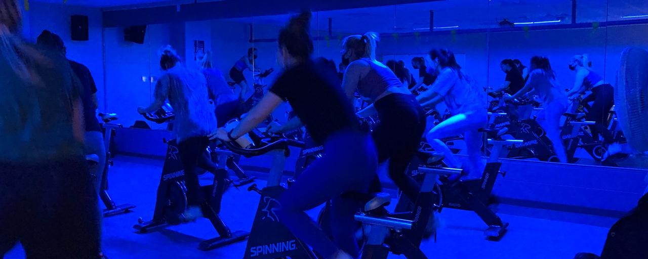 Students cycling in their spin class